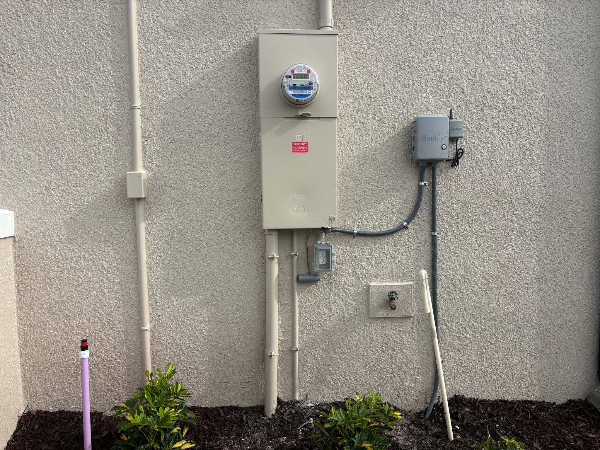 Exterior electrical meter and service equipment mounted on a home